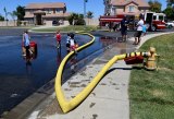 The neighborhood kids at Lemoore's Paradise Loop enjoyed an afternoon of hot dogs and water works with the Lemoore Volunteer Fire Department as volunteers held a sort of block party on Saturday.